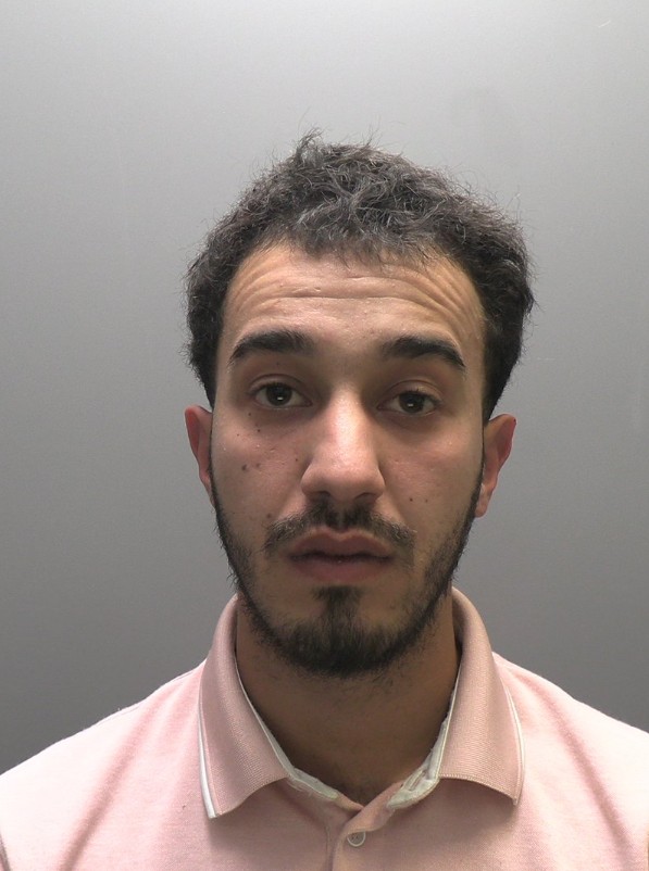 Mugshot of Adam Zawi, an asylum seeker accused of stealing valuables from city workers.