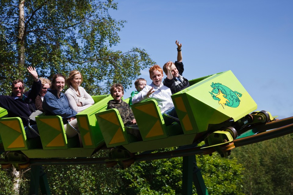 Families and children riding The Green Dragon rollercoaster at Greenwood Forest Park.