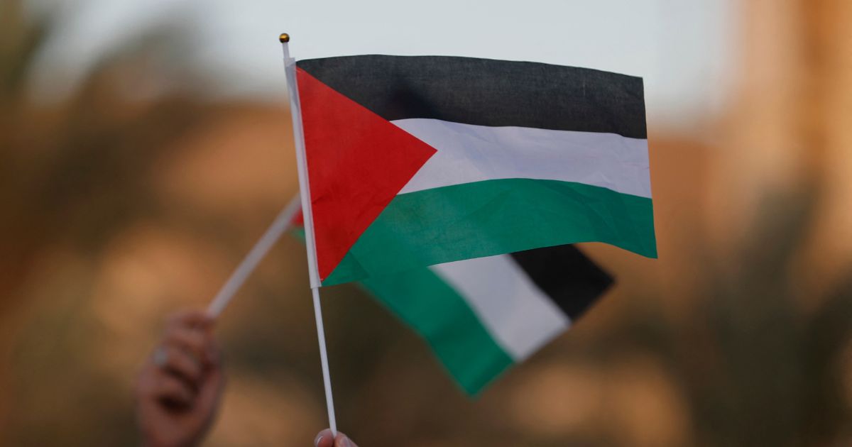 Iraqi citizens raise Palestinian flags during an anti-Israel rally in Baghdad on Sept. 23, 2025.