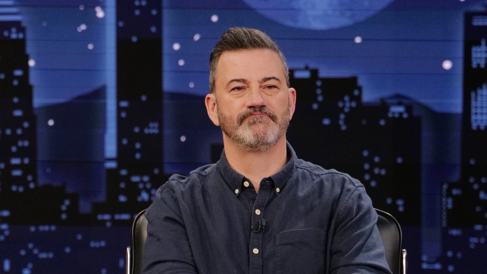 Jimmy Kimmel wearing a blue button-down shirt.