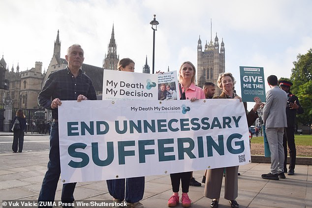 Campaigners from Humanists UK and My Death My Decision hold banners and placards in support of the Assisted Dying Bill last week