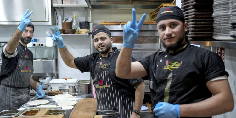 After migrant influx, Germany seeks balance