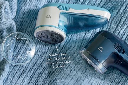 Two fabric shavers on a blue sweater.
