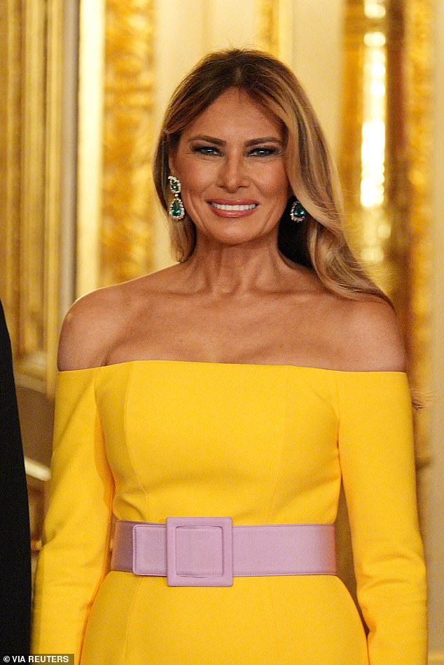 Melania turned heads in a Carolina Herrera yellow, off-the-shoulder gown with a lavender purple belt and emerald earrings