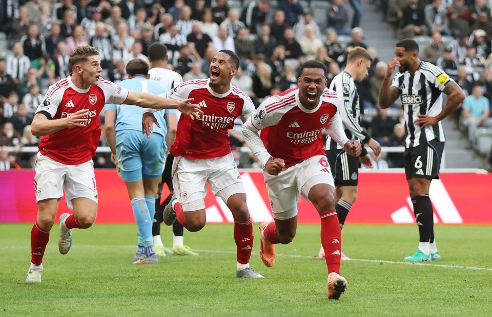 Arsenal players celebrating a goal with Gabriel of Arsenal celebrating his team's second goal.