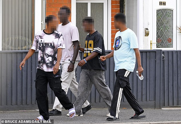 Somali and Afghan men, some fresh off the Channel boats, are the new residents of three big Victorian houses in Skegness. Pictured: Somali Men seen leaving 33 and 35, Grosvenor Road