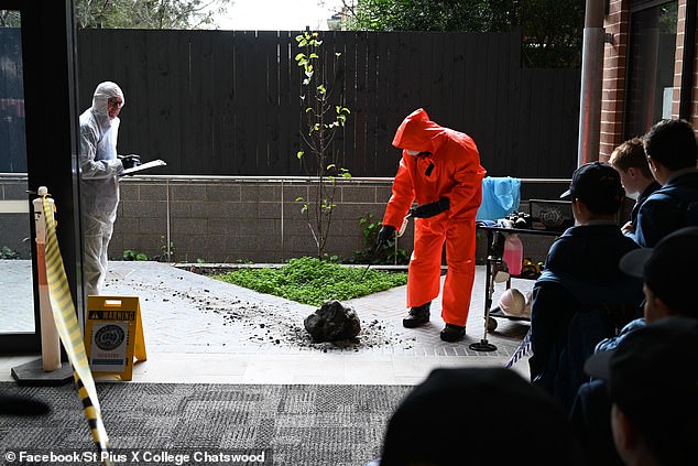 Experts investigated the meteorite outside St Pius X College in Chatswood last Monday