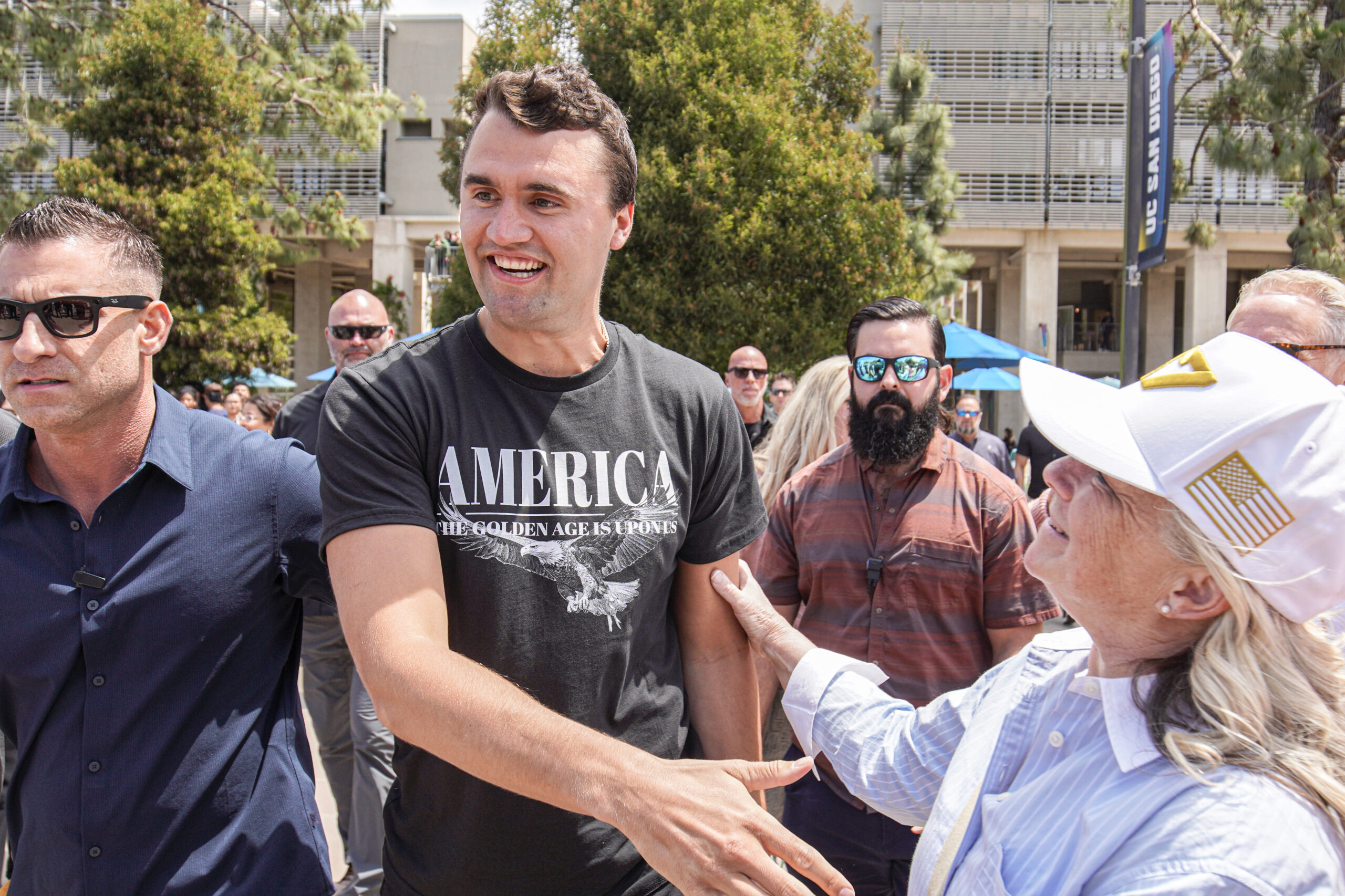 Charlie Kirk, founder of Turning Point USA, enters the plaza