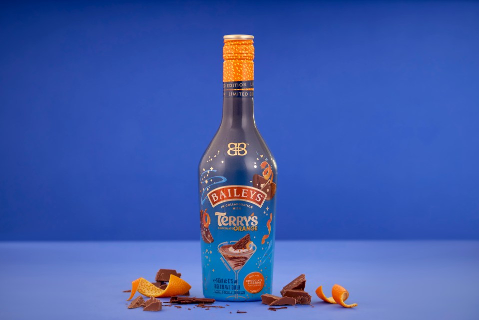 Bottle of Baileys Terry's Chocolate Orange liqueur with chocolate and orange peel.
