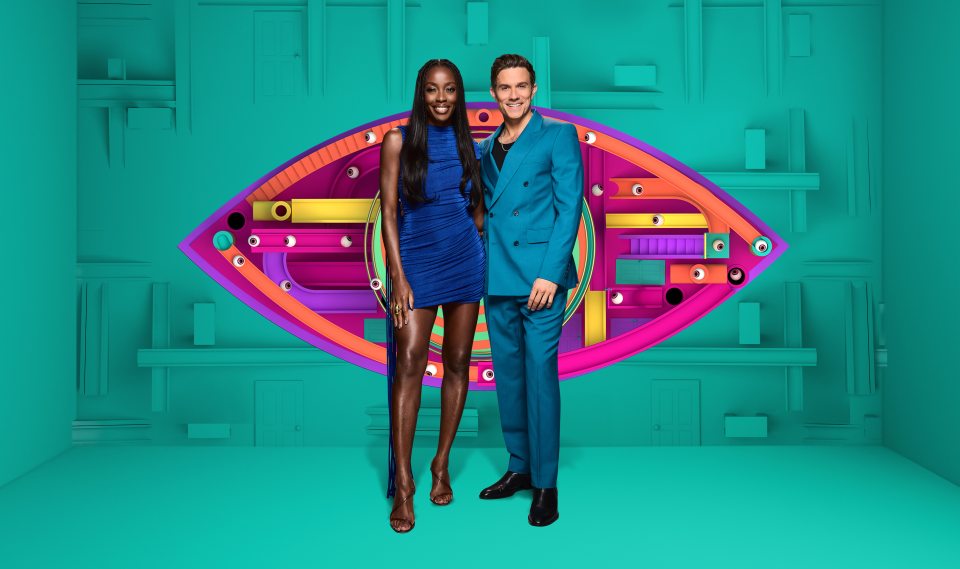 Big Brother hosts AJ Odudu and Will Best stand in front of the Big Brother eye logo.