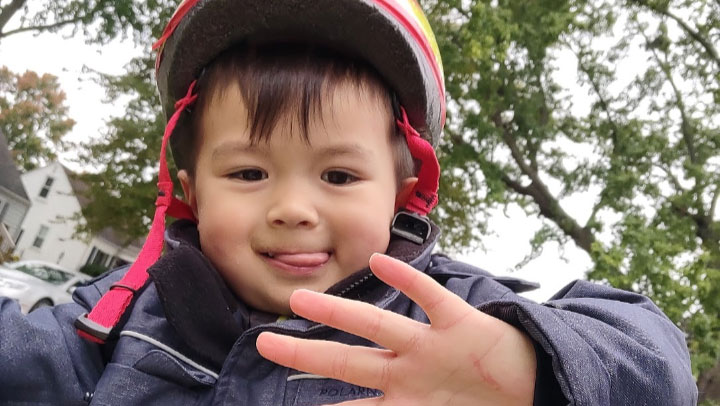 The 5-year-old Michigan boy Thomas Cooper in a helmet.