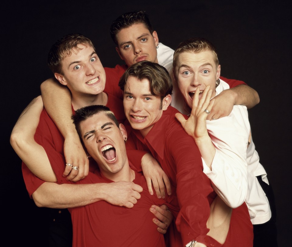 Boyzone members Mikey Graham, Keith Duffy, Ronan Keating, Stephen Gately, and Shane Lynch in a group photo from 1995.