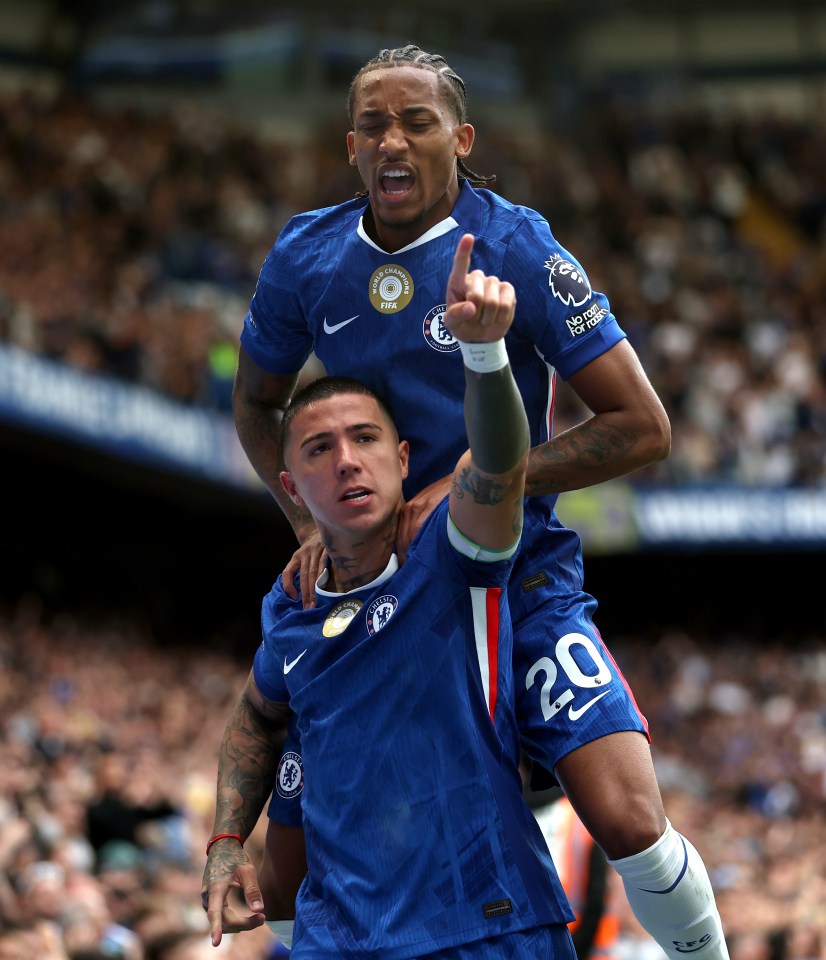 Enzo Fernandez of Chelsea celebrates a goal with a teammate.