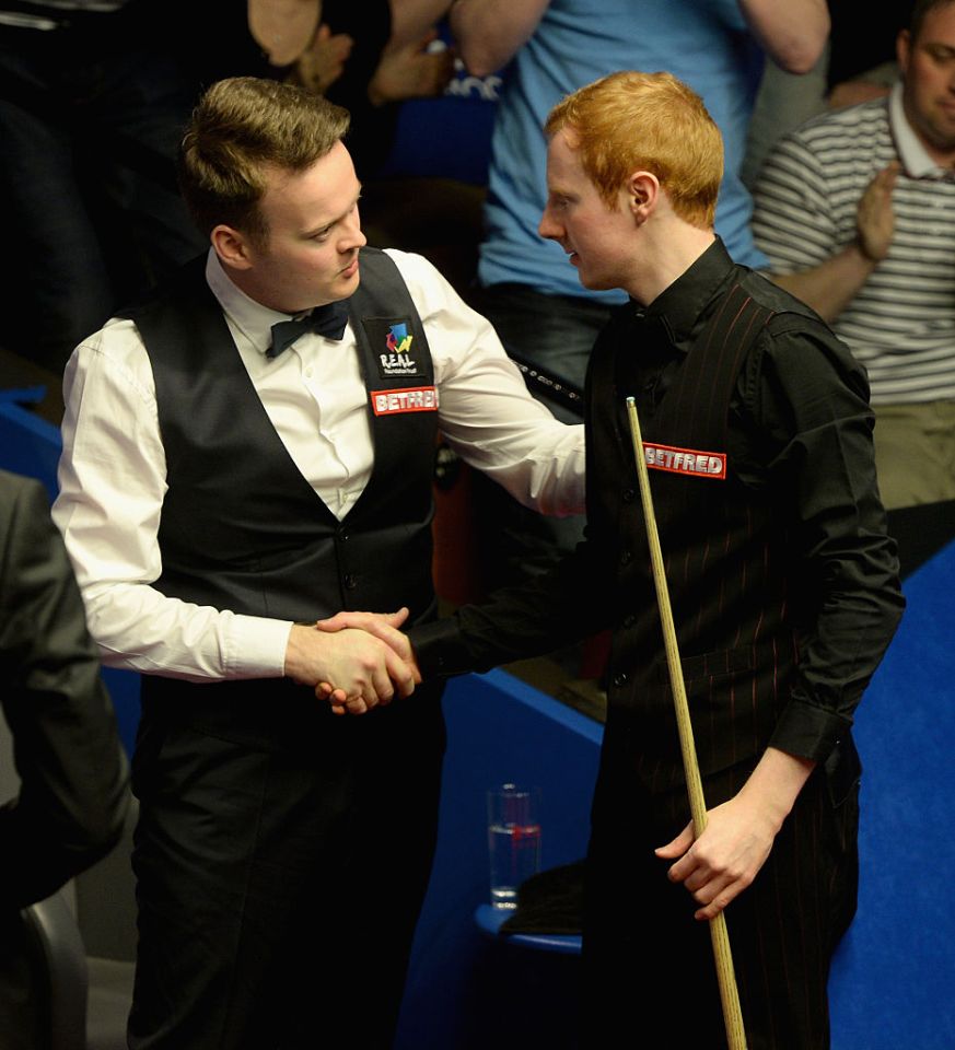 SHEFFIELD, ENGLAND - APRIL 17:  Anthony McGill shakes hands with Shaun Murphy after beating him during their first round match of the 2016 Betfred World Snooker Championship at Crucible Theatre on April 17, 2016 in Sheffield, England.  (Photo by Gareth Copley/Getty Images)