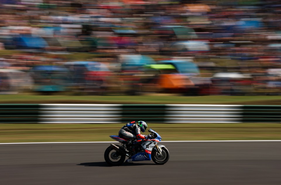 A motorcyclist racing on a track.