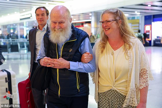 Mr Reynolds pictured with his daughter Sarah Entwistle at Heathrow Airport