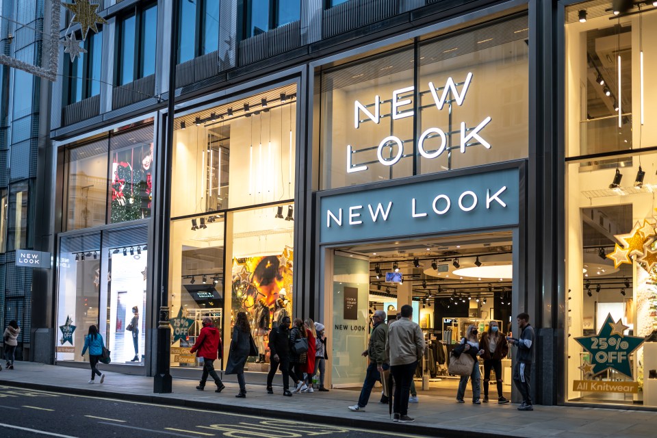 Exterior of a New Look fashion store with people walking outside.