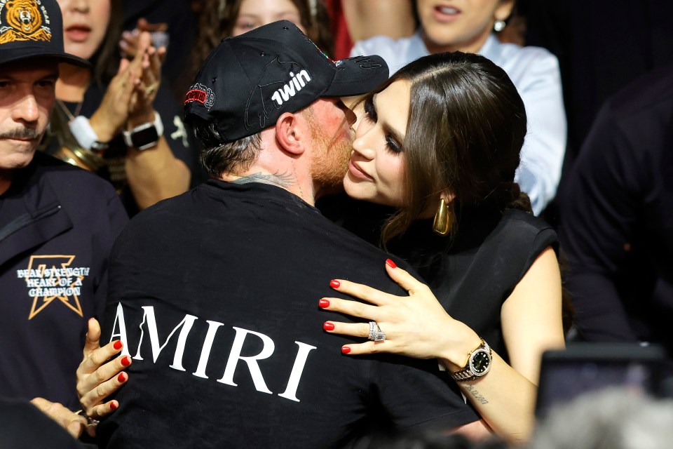 Canelo Alvarez kisses his wife, Fernanda Gomez, after a boxing match.