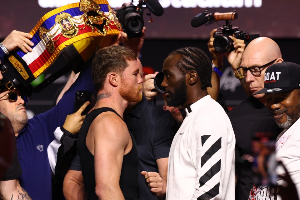 Canelo Alvarez and Terence Crawford face off at a press conference.