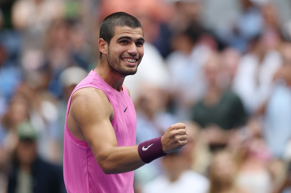 Carlos Alcaraz celebrating a tennis match victory.