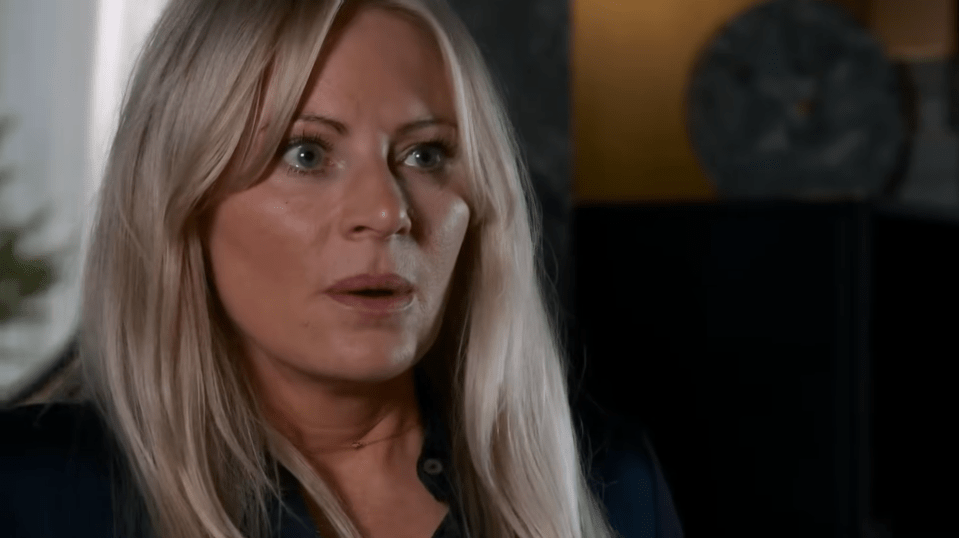 Screenshot of a blonde woman looking surprised.