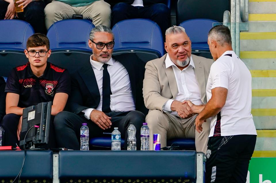 Two Salford owners, Dario Berta and Saia Kailahi, at a rugby match.