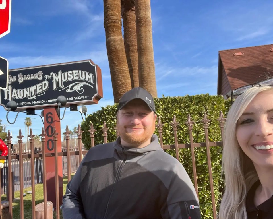 A man and a woman in front of Zak Bagans' The Haunted Museum.