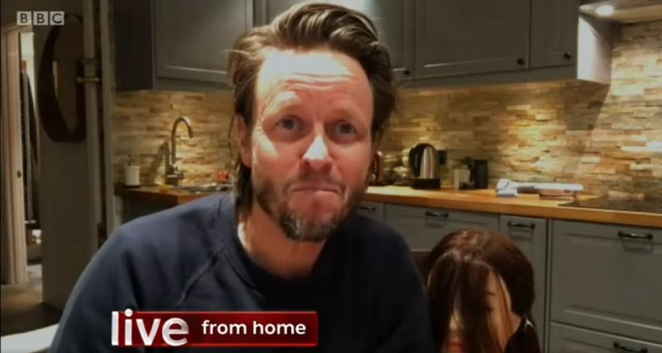 Michael Douglas on BBC The One Show demonstrating hair cutting and coloring at home.
