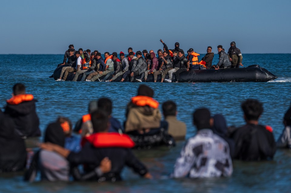 Migrants in a small boat crossing the English Channel.