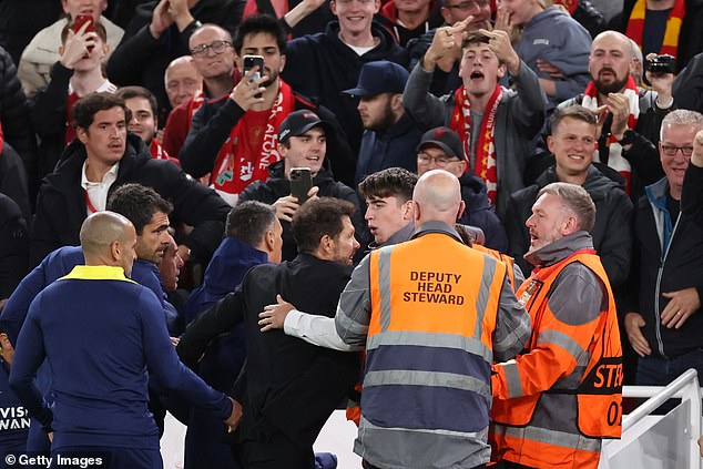Diego Simeone tussled with jubilant Liverpool fans after the latest of winners from Virgil van Dijk in added time