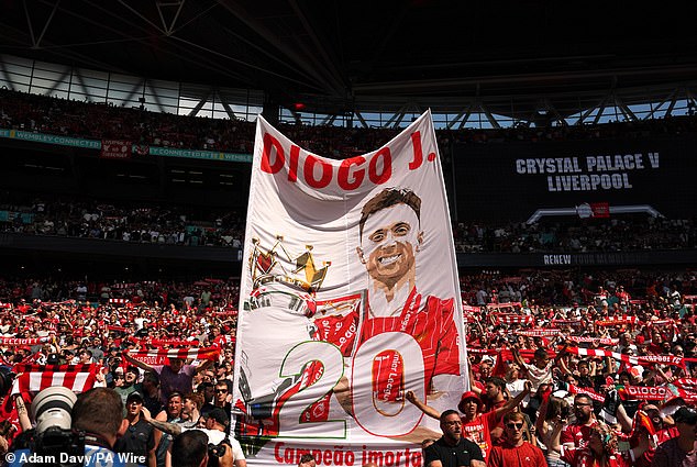 A banner depicting Jota holding the Premier League trophy was held aloft during Liverpool's match against Crystal Palace on August 10