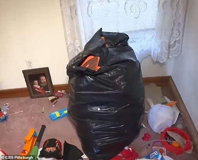 Flanigan shot chilling video of the trash piled and scattered throughout the wrecked house (pictured)