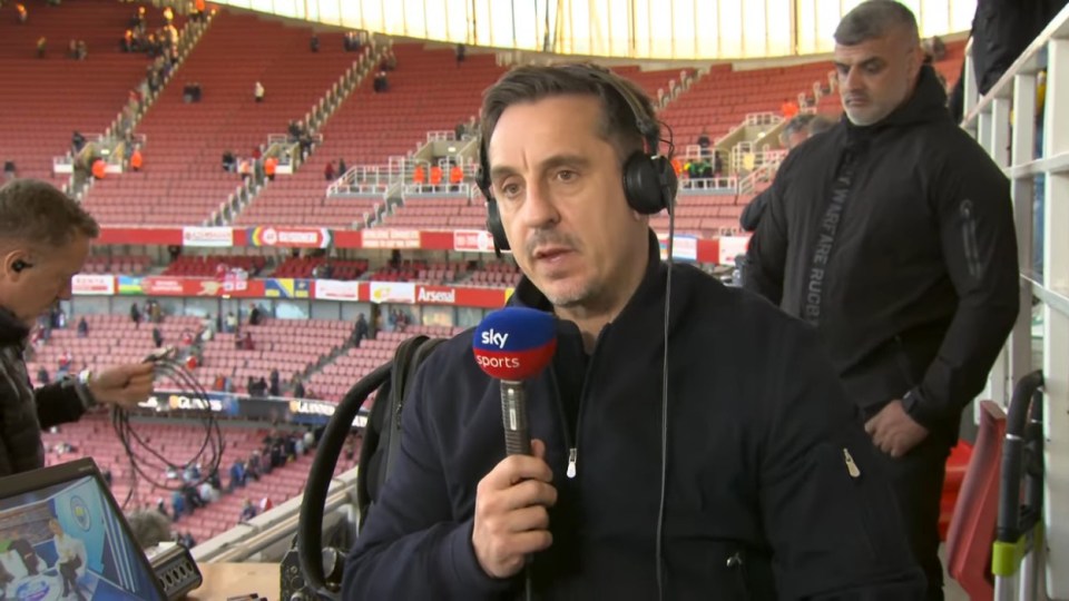 Gary Neville providing commentary for Sky Sports at the Emirates Stadium.