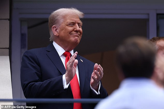 Donald Trump was greeted with cheers and boos when he arrived at the US Open final Sunday