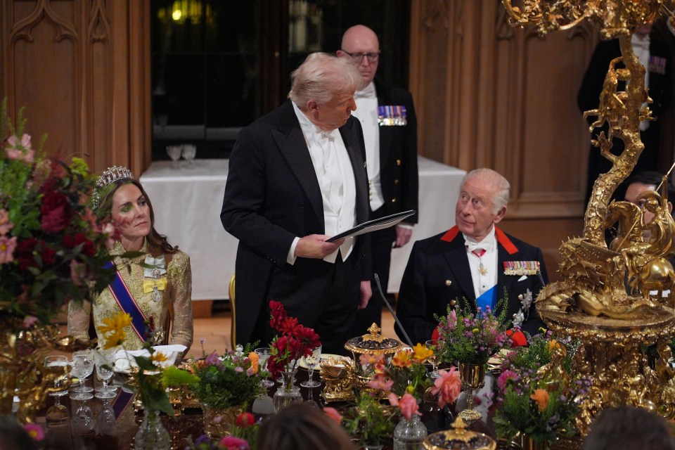 US President Donald Trump delivers a speech as King Charles III and the Princess of Wales listen during a state banquet at Windsor Castle.