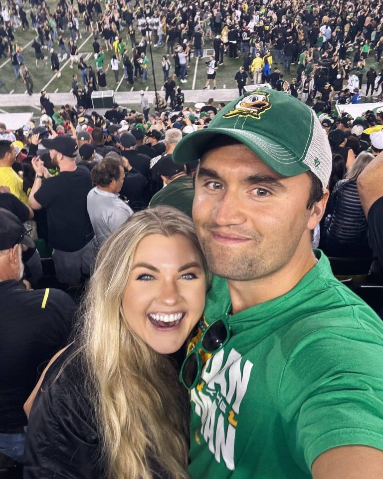Charlie Kirk and Erika Frantzve at a football game.