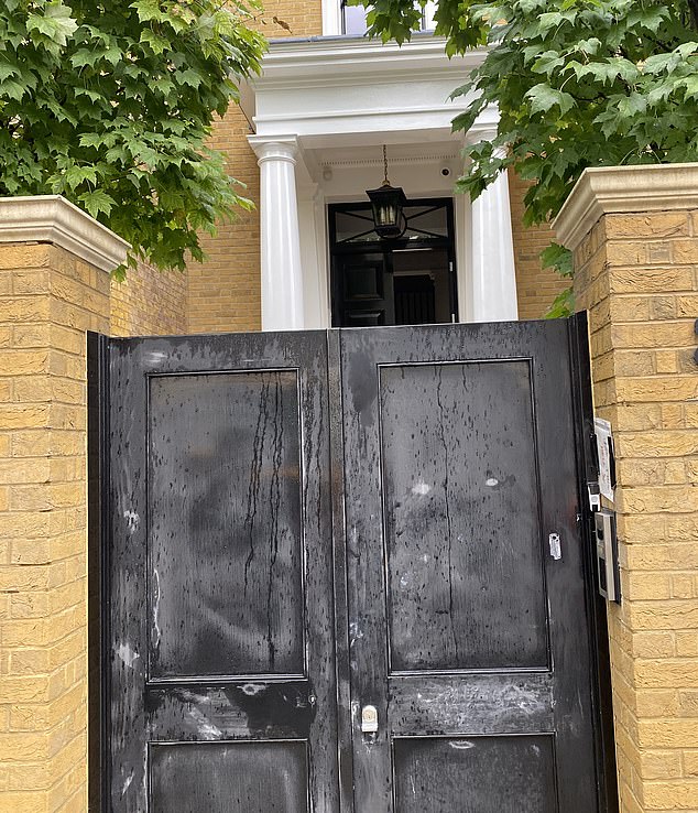A group of builders regularly come in and out of the unwanted home, with loud construction sounds echoing down the sleepy London street