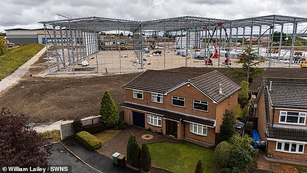 Residents branded the colossal steel frames, pictured, 'monstrous' as they became the latest structures at a 350,000 sq ft industrial site
