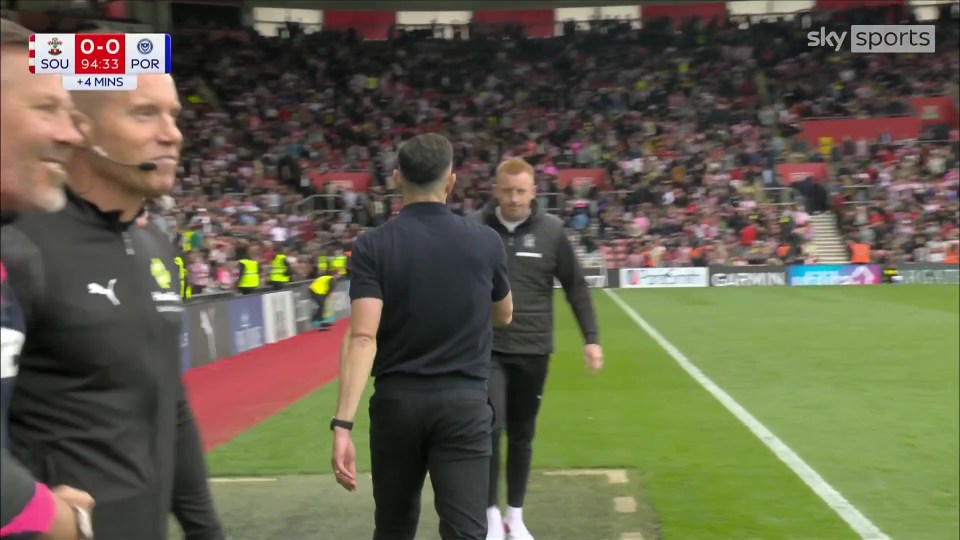 John Mousinho and Will Still on a soccer field.