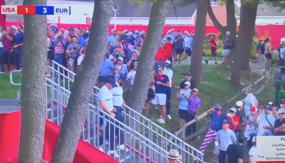 Golf fans watching a match between USA and Europe, with USA scoring 1 and Europe scoring 3.