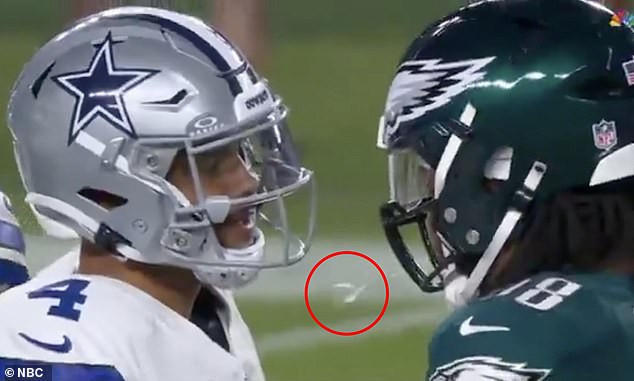 Jalen Carter (right) inexplicably spat at Cowboys quarterback Dak Prescott six seconds in