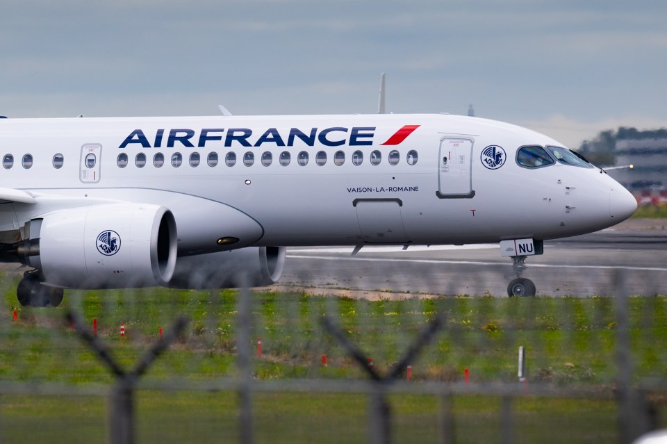 Air France passenger airplane on a runway at London Heathrow Airport, preparing for takeoff to Paris.