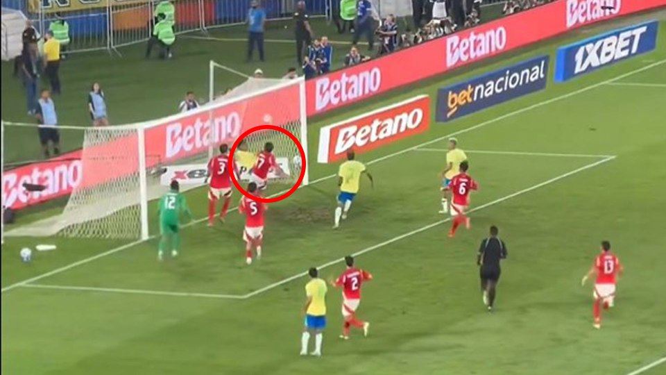 Soccer players near the goal.