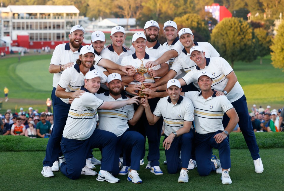 Team Europe golfers celebrating with the Ryder Cup trophy.