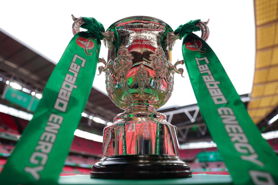 The Carabao Cup trophy with green ribbons.