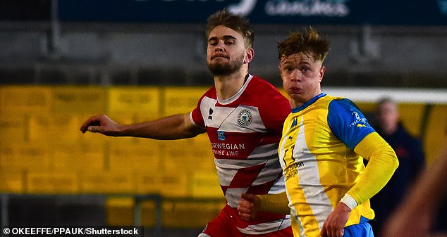 Vigar (left) pictured playing for Eastbourne Borough against Torquay United in 2024