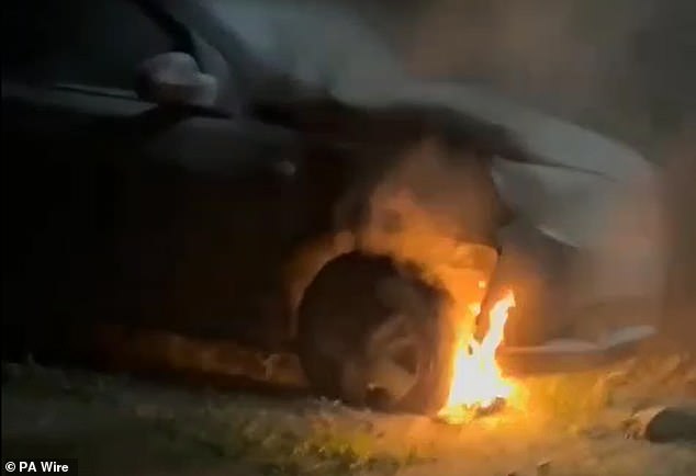 A farmer and landlord in Ballymena has said there has been a 'campaign of hate' against him and his Filipino tenants. Pictured: Handout grab from video of a car which was set on fire in Ballymena, Co Antrim on Sunday and destroyed