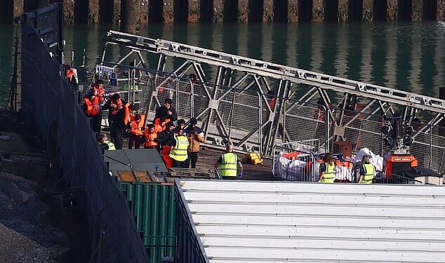 Migrants disembarking from a Border Force vessel at Dover on September 19, a day which saw 1,072 arrivals across the Channel in total