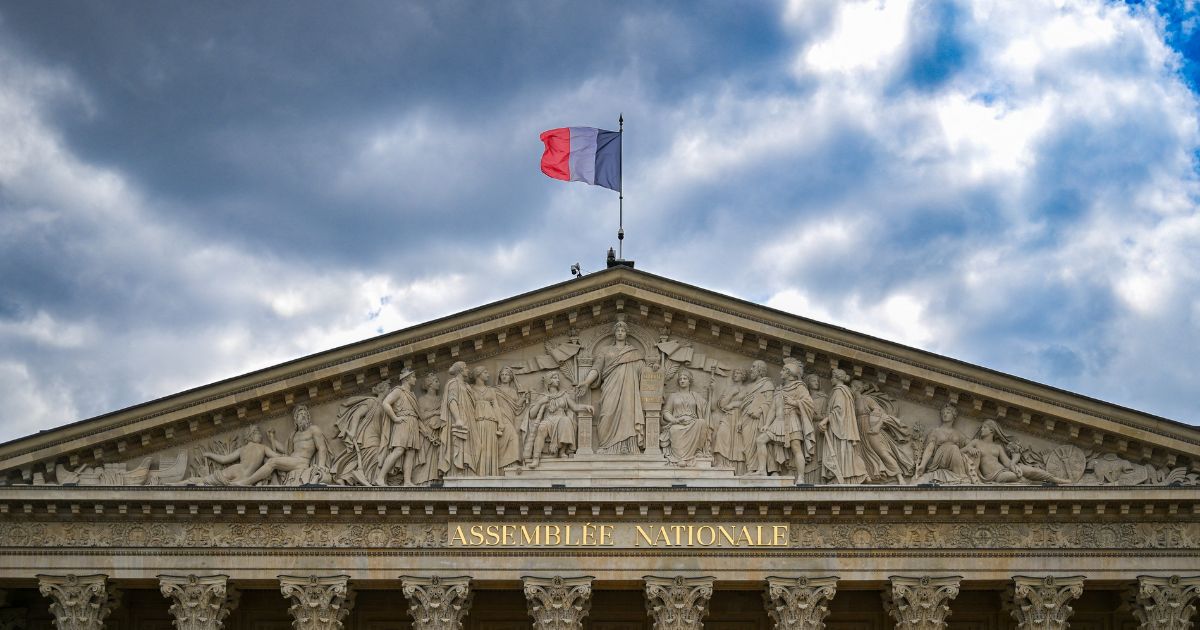 Illustration of the pediment sculpted by Jean-Pierre Cortot on the Palais Bourbon, home of the French National Assembly, with the French flag flying at the top, in Paris, France, on Aug. 1, 2025.