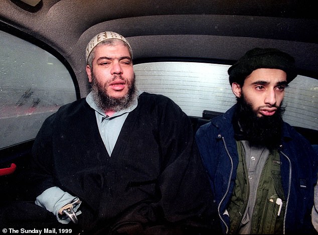 Radical cleric Abu Hamza al Masri (left) rides in a car in London, January 20, 1999, with Haroon Aswat (right)